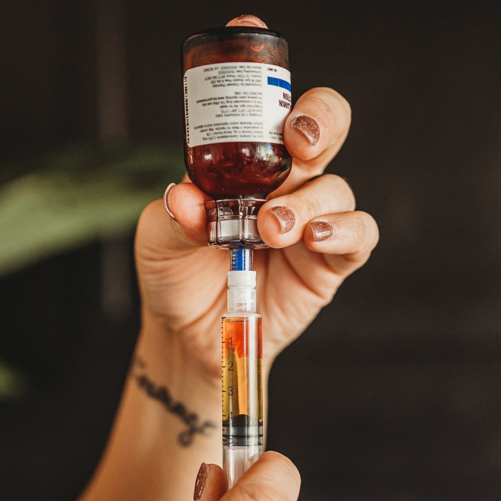 IV vitamin therapy nurse in Brent Cross - NW4 preparing mobile drip session